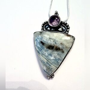 1 1/2 inch, Decent Blue Scheelite and Amethyst pendant on silver chain.